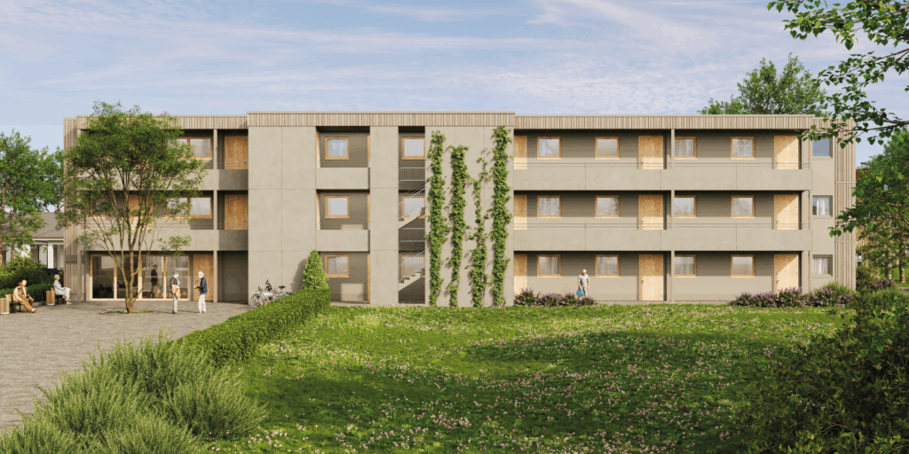 Moderne Wohnanlage mit begrüntem Vorplatz, Bäumen und Personen, die sich im Freien aufhalten.